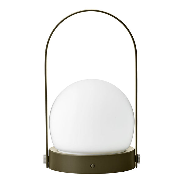Round white glass lamp with a sleek olive green base and handle, perfect for modern decor styling.