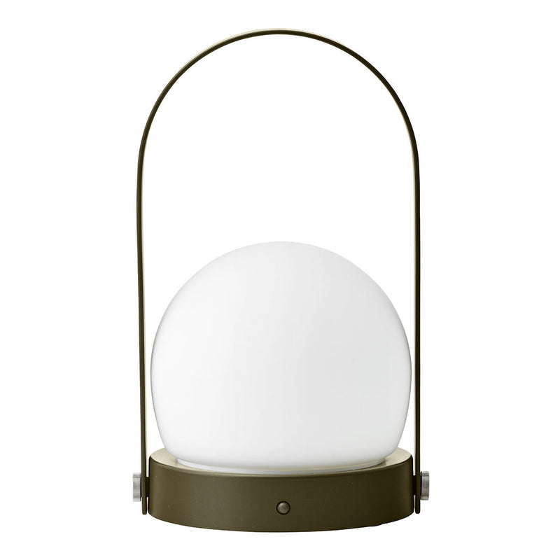 Round white glass lamp with a sleek olive green base and handle, perfect for modern decor styling.