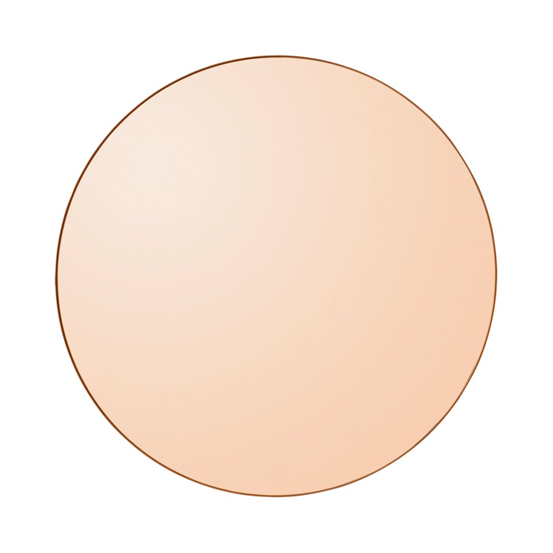 Round blush mirror in soft peach tone with a sleek gold outline. Ideal for elegant home decor.