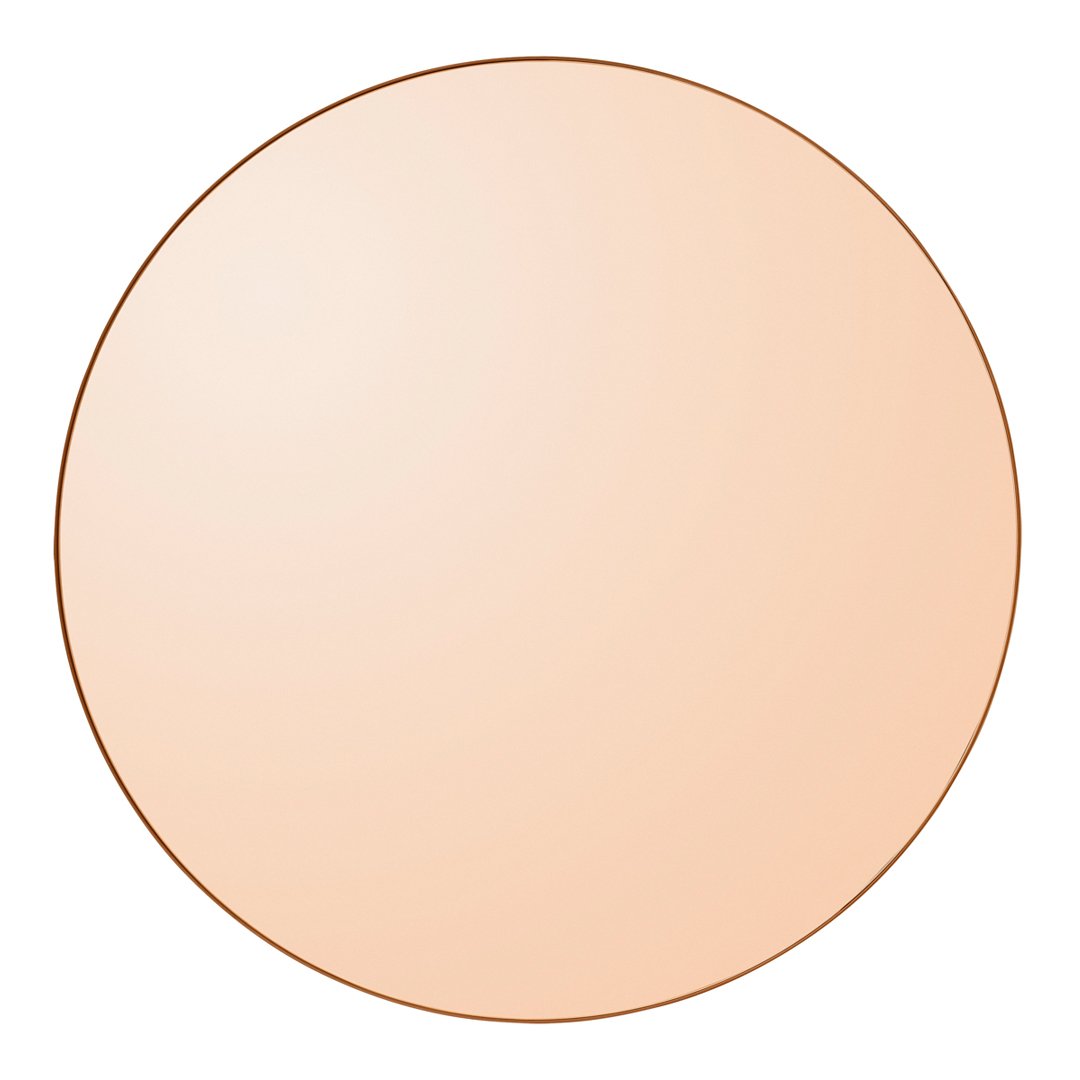 Round mirror with a smooth, reflective surface in soft peach color and thin rose gold outline.