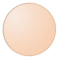 Round mirror with a smooth, reflective surface in soft peach color and thin rose gold outline.
