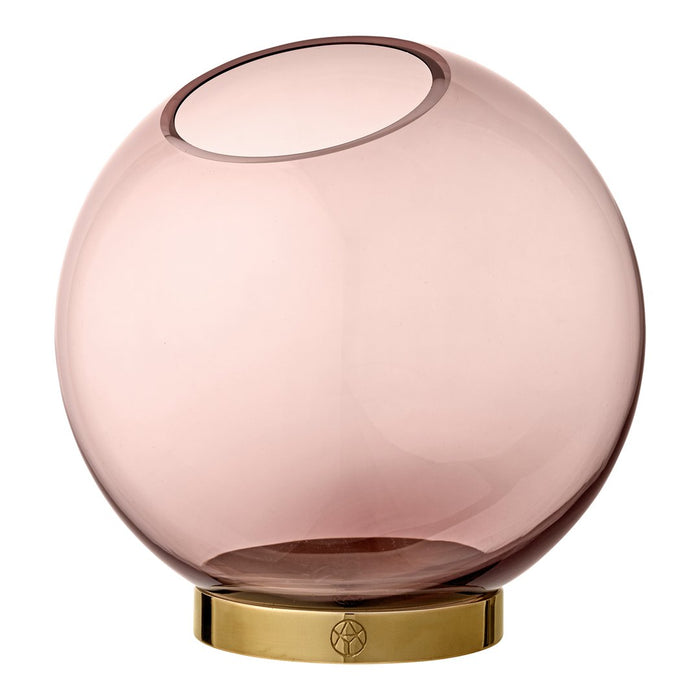 Pink glass vase with a smooth, rounded shape and a gold base, perfect for modern decor.