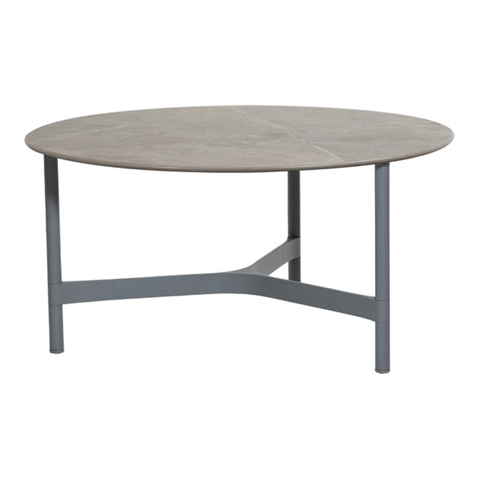 Round coffee table with a light wood top and gray metal legs, featuring a sleek, modern design.
