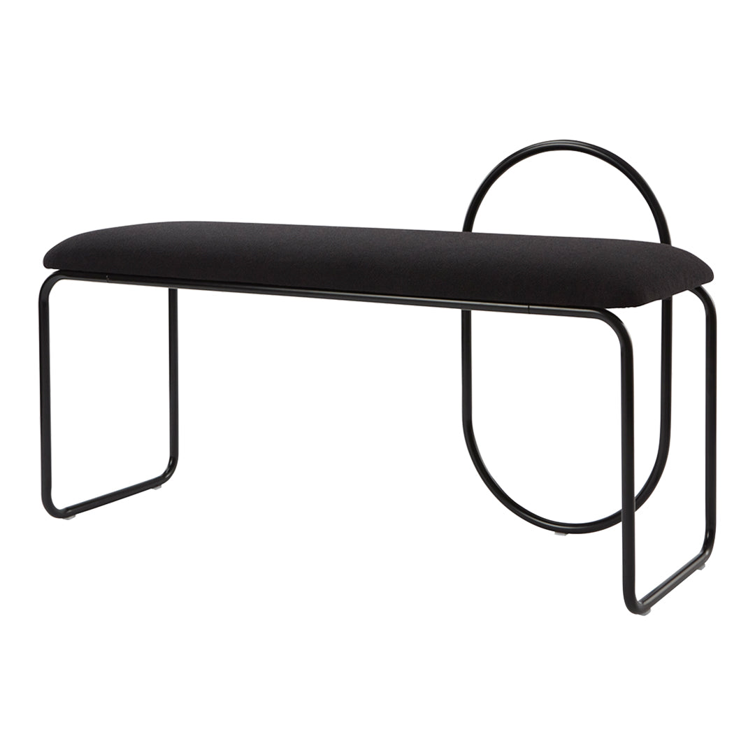 Black upholstered bench with sleek black metal frame and geometric circle accent, modern minimalist design.