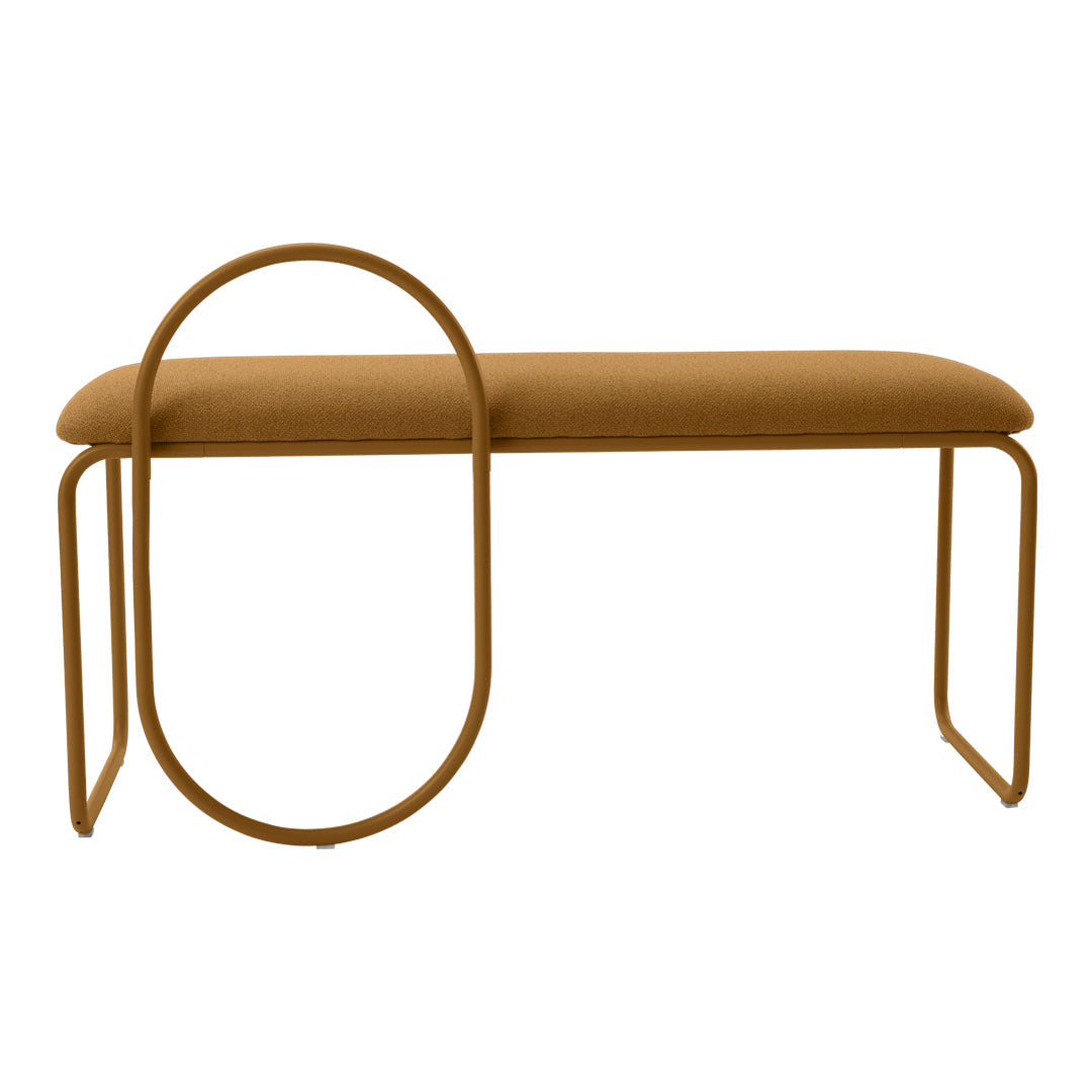 Stylish mustard yellow bench with a unique circular design on a gold metal frame. Modern and eye-catching home decor.