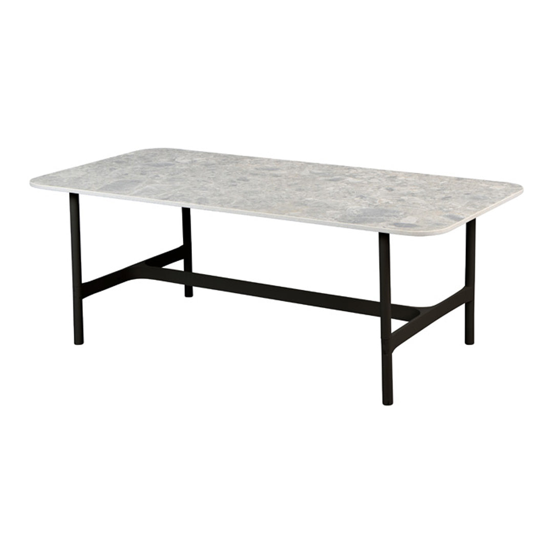 Rectangular marble coffee table with a subtle gray pattern and black metal legs for a modern touch.