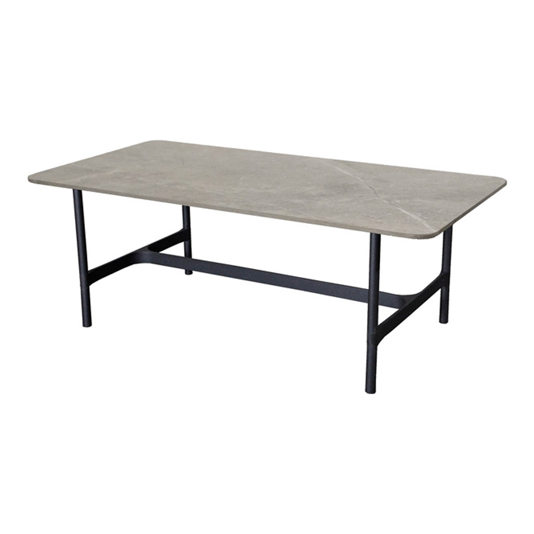 Gray faux marble tabletop with subtle veining, supported by a simple black metal frame. Ideal for modern decor.
