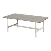 Gray rectangular tabletop with subtle marbling, set on a sleek white metal frame. Modern and minimalist design.