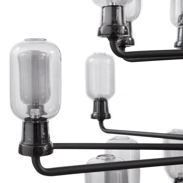 Glass bulb chandelier with black metal arms, showcasing a sleek, modern design and clear glass accents.