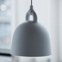 White dome pendant lamp with a smooth matte finish and minimalist design, featuring a subtle hanging loop detail.