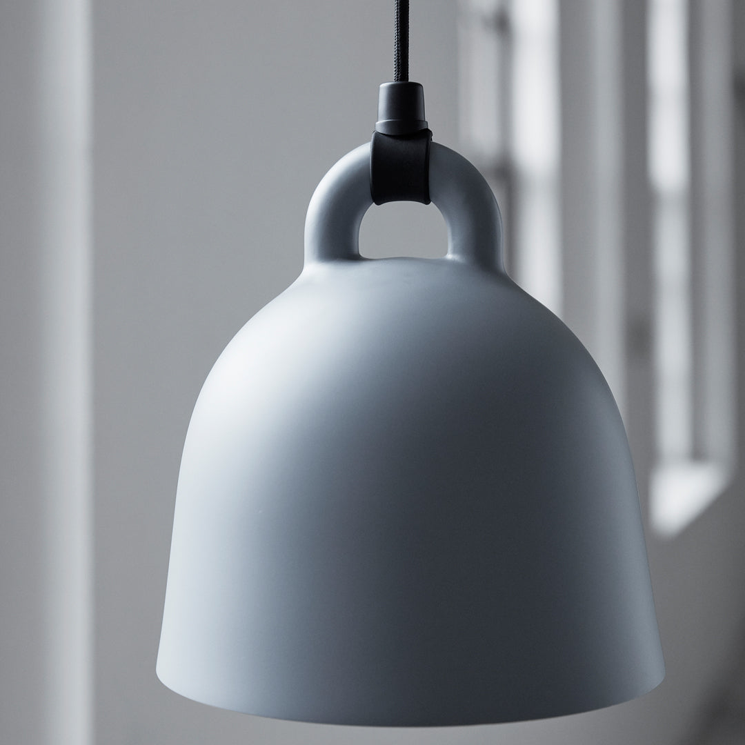 Round gray pendant lamp with a smooth matte finish and minimalistic design, perfect for modern decor.