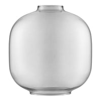 Clear, round glass vase with a smooth, minimalist design and no patterns, ideal for modern decor.