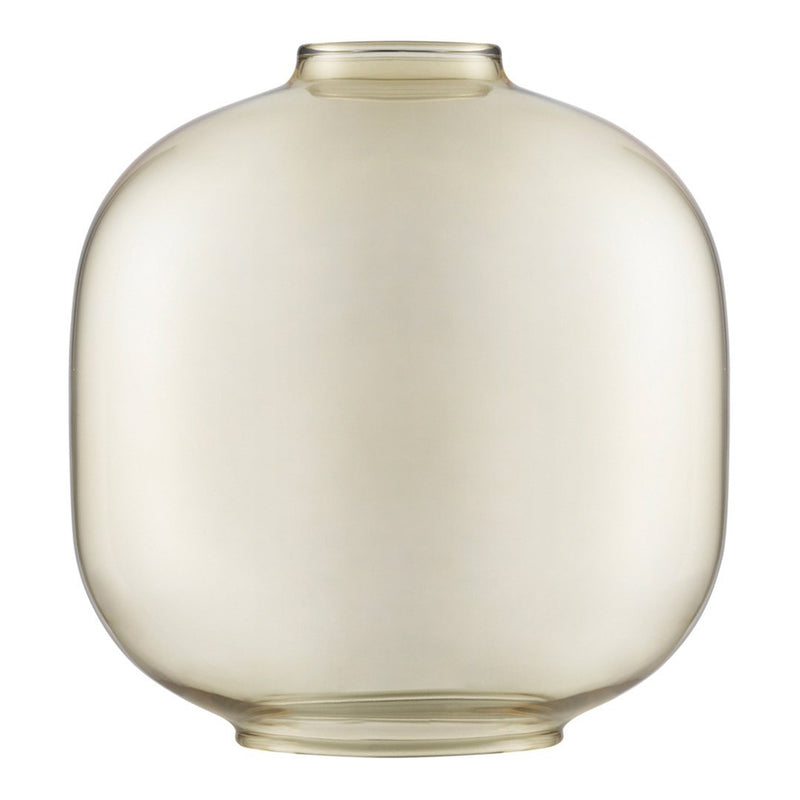 Clear glass vase with a rounded shape and soft amber hue, perfect for modern decor. Smooth, minimalist design.