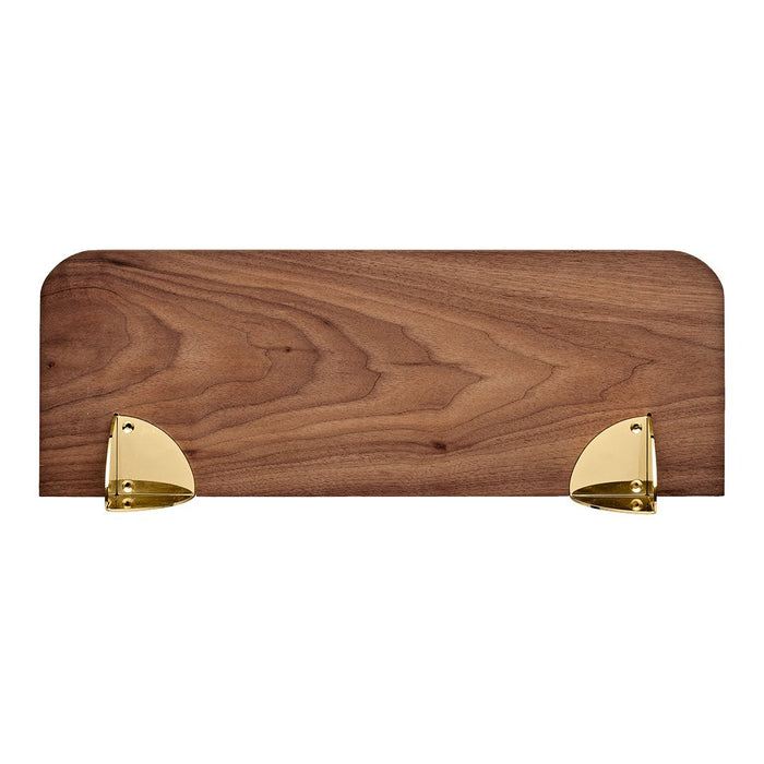 Rich walnut wood shelf with smooth grain, featuring sleek gold metal brackets. Elegant and stylish design.