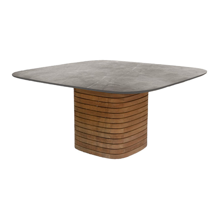 Square dining table with a sleek gray top and a striped wood base, blending modern and natural textures.