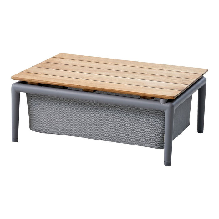 Rectangular coffee table featuring a natural wood top and gray fabric base, designed with a sleek, modern aesthetic.