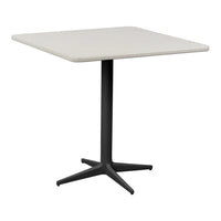 Square table with a light beige tabletop and a sleek black pedestal base, perfect for modern decor.