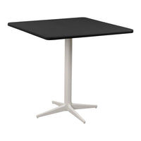 Black square table with a sleek, matte surface and a contrasting white pedestal base. Modern and minimalist design.