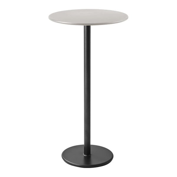 Minimalist round table with a sleek white top and matte black base, perfect for modern decor.