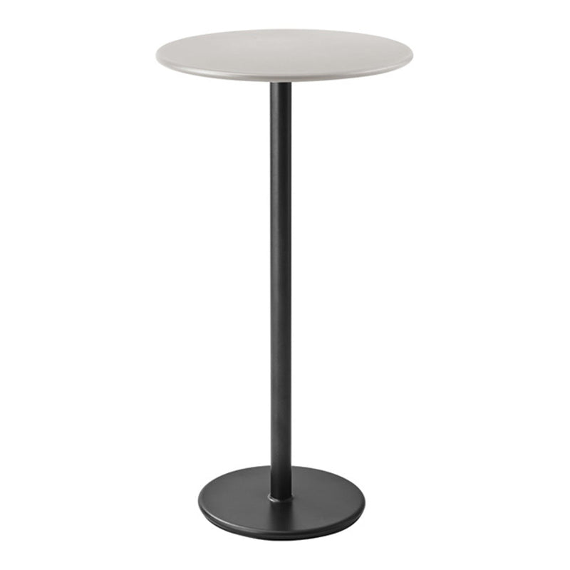 Minimalist round table with a sleek white top and matte black base, perfect for modern decor.