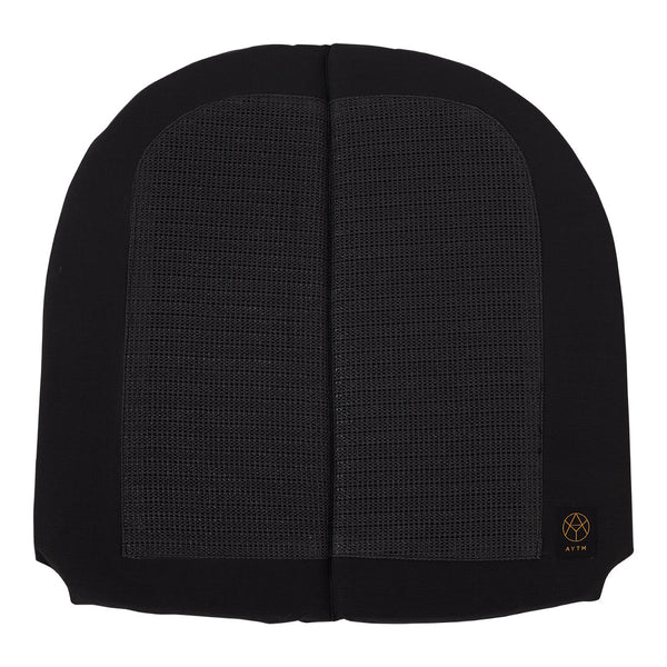 Black fabric with a textured pattern, featuring distinct smooth and mesh sections, highlighting modern design elements.