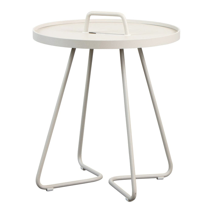 Round cream-colored table with a sleek, minimalist design and three white metal legs. Perfect for modern decor.