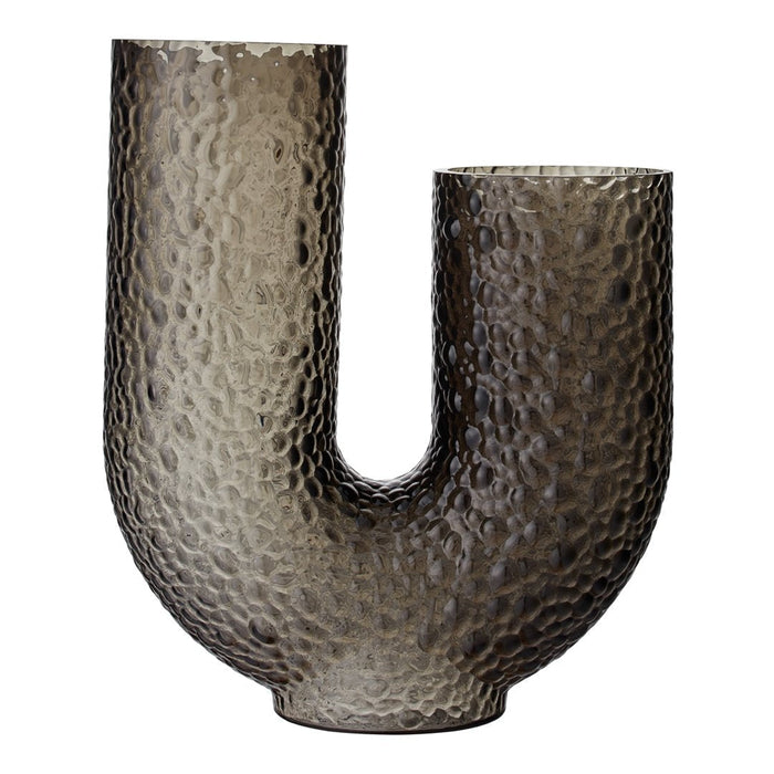 Textured glass vase in a sleek U-shape, featuring a muted gray hue and a hammered finish for added visual interest.