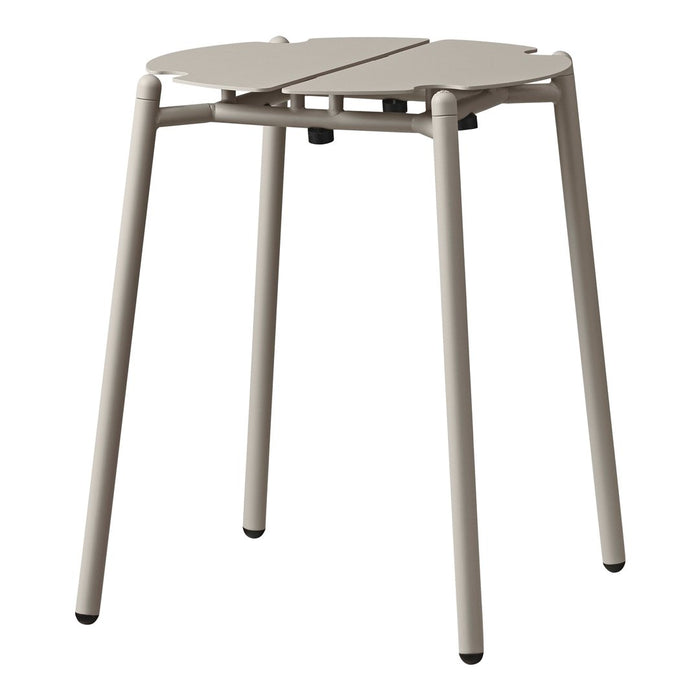 Light beige, minimalist design folding stool with a smooth, matte finish and simple round pattern.