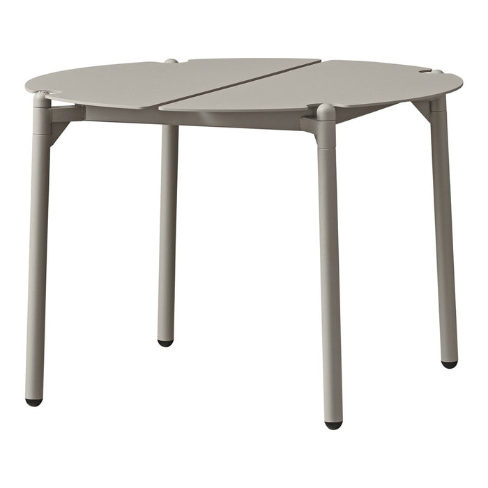 Light gray round table with a sleek, minimalist design and smooth surface. Perfect for modern decor.