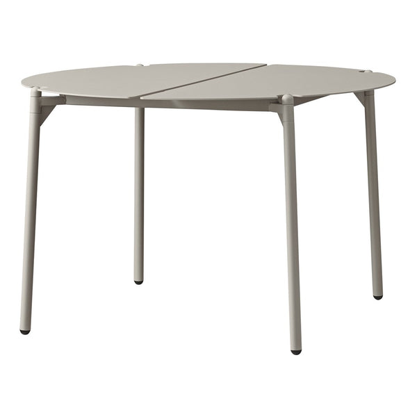 Round beige table with a smooth surface and minimalist design, featuring clean lines and subtle color variations.