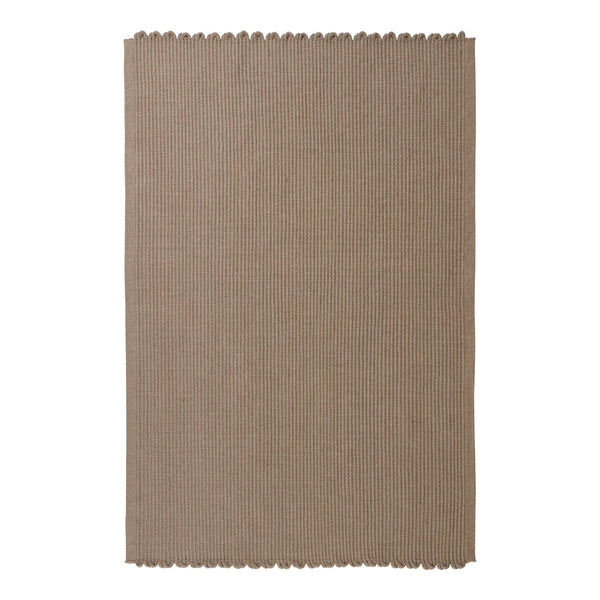 Taupe woven rug with a subtle texture and scalloped edges, ideal for adding warmth to any space.