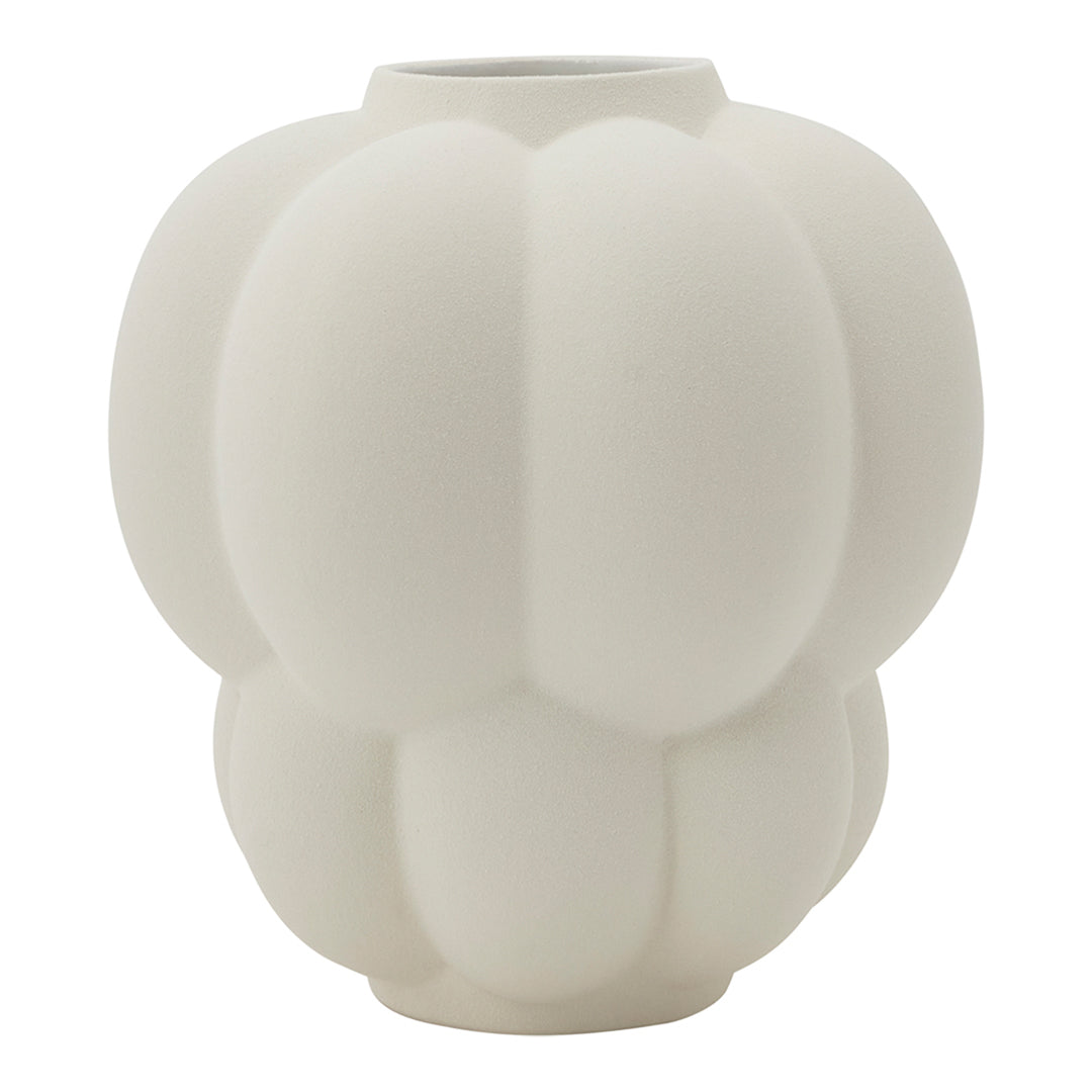 White textured ceramic vase with a unique pumpkin-inspired shape and soft, matte finish. Elegant minimalist design.
