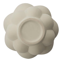 Cream-colored, textured bowl with a floral, petal-like pattern and smooth interior finish. Perfect for stylish décor.