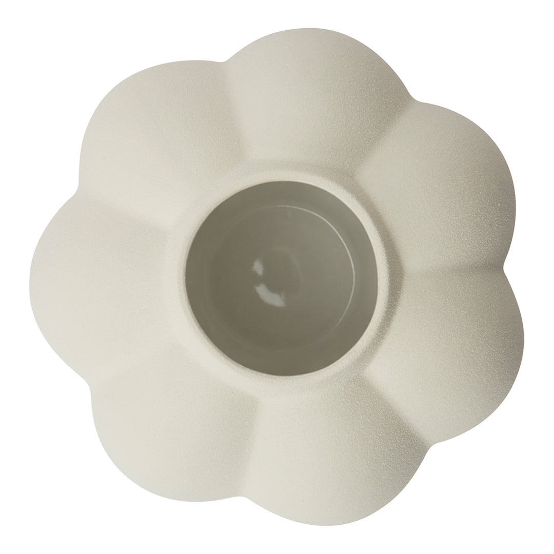 White flower-shaped ceramic pot with a textured surface and smooth inner finish. Ideal for indoor plants.