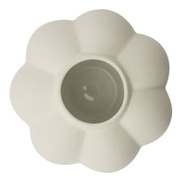 White flower-shaped ceramic pot with a textured surface and smooth inner finish. Ideal for indoor plants.
