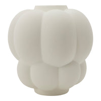 White decorative vase with a soft, rounded, tiered pattern, perfect for modern home decor.