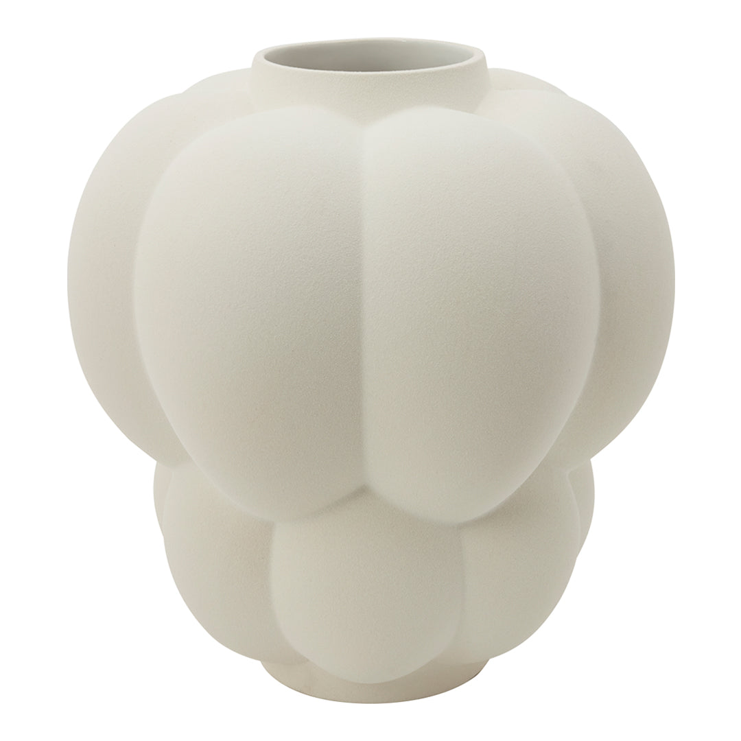 White matte ceramic vase with a textured, rounded design featuring soft, organic shapes and a modern aesthetic.