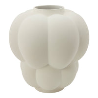 White matte ceramic vase with a textured, rounded design featuring soft, organic shapes and a modern aesthetic.