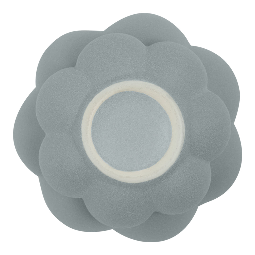 Soft gray flower-shaped silicone mold with rounded petals and a white center. Ideal for baking and crafting.