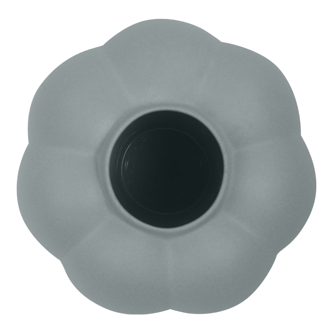 Gray flower-shaped pot with a smooth surface and a black interior. Elegant, minimalist design for modern decor.