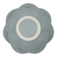 Gray flower-shaped dish with a smooth surface and white center, perfect for modern table settings.