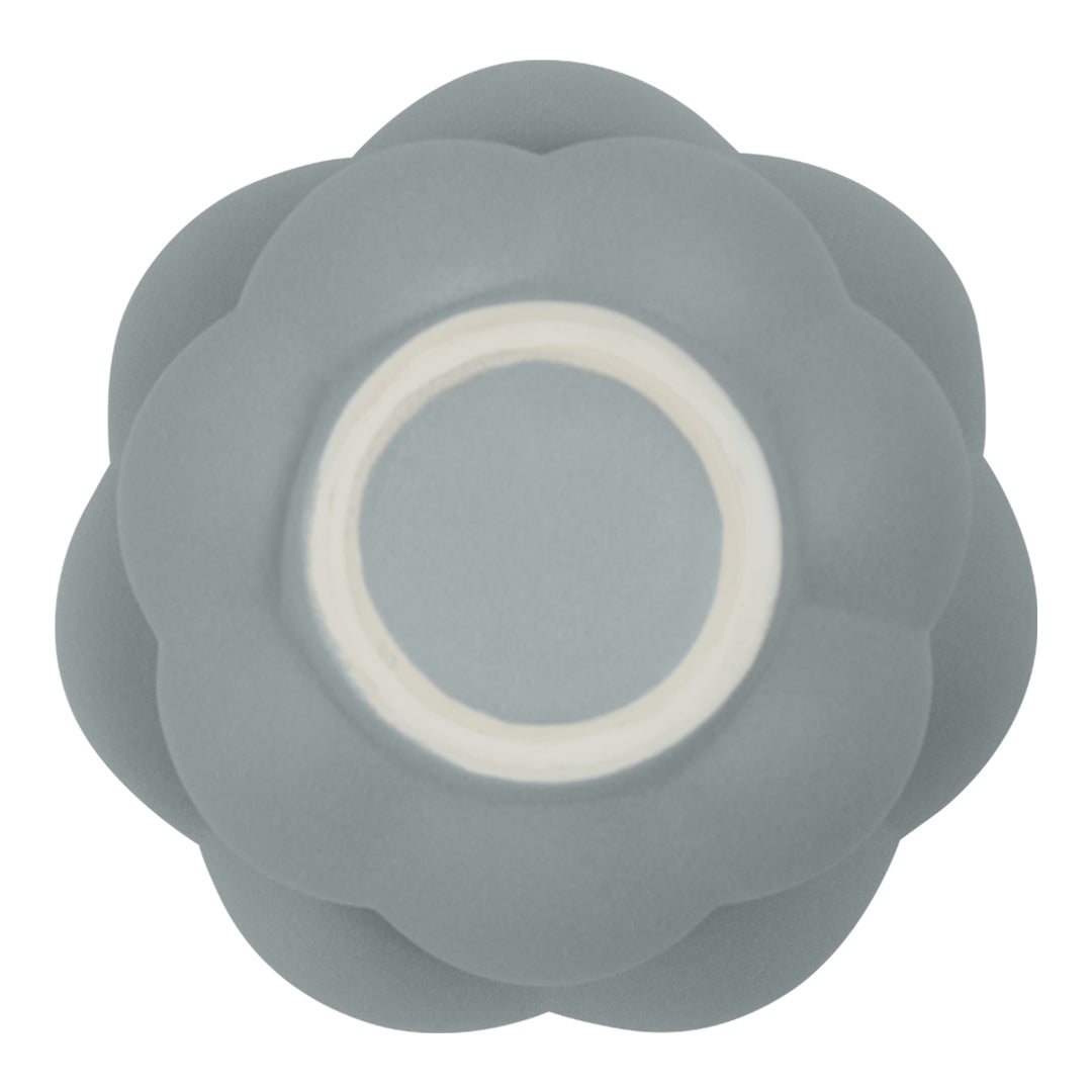 Gray silicone bowl with a layered flower design and a white inner rim. Ideal for modern, chic kitchen decor.
