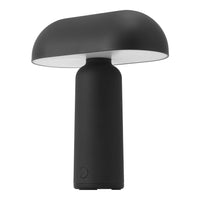 Black and white modern lamp with a sleek, smooth finish and rounded shade design. Perfect for minimalist decor.