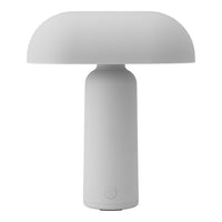 White minimalist table lamp with a smooth, rounded shade and cylindrical base, perfect for modern decor.