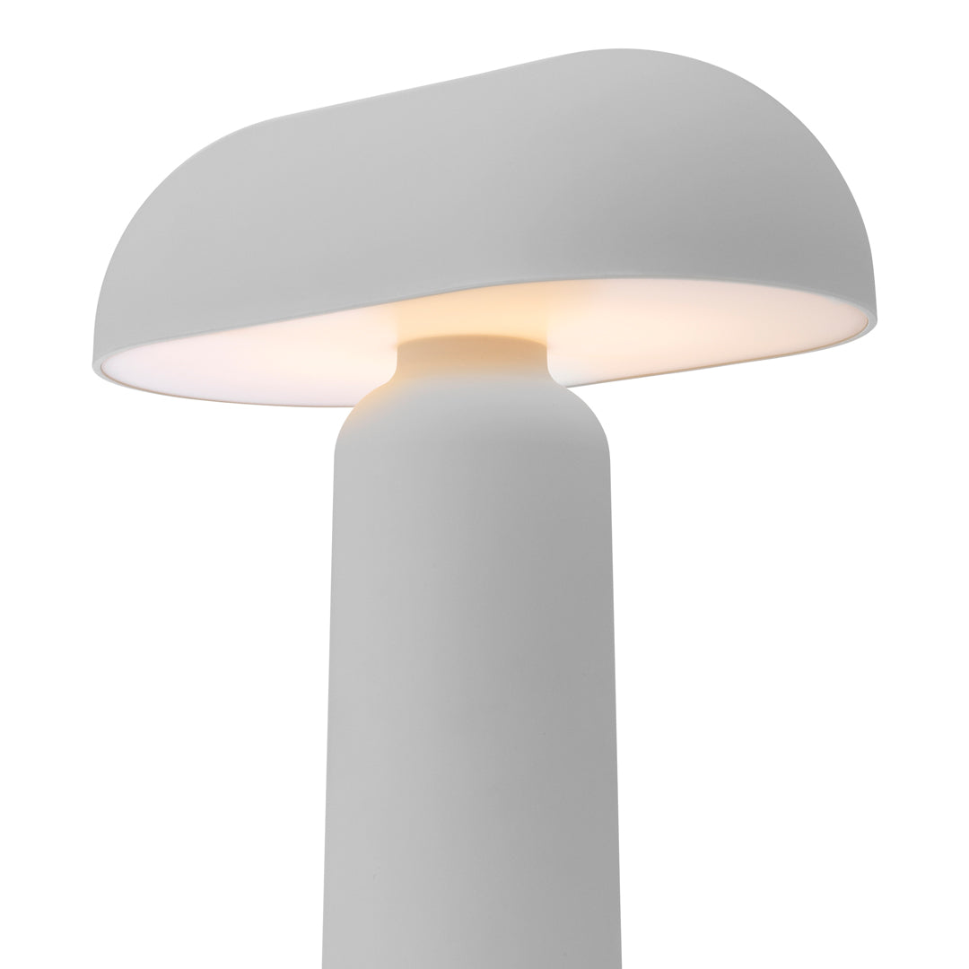 Minimalist white lamp with a smooth, rounded shade and gentle warm light. Perfect for modern decor.