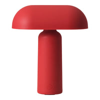 Red lamp with a smooth, rounded shade and a cylindrical base, showcasing a modern, minimalist design.