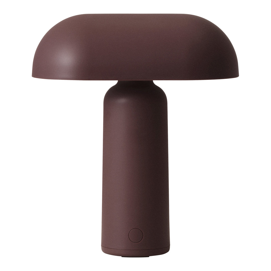 Brown mushroom-shaped table lamp with a smooth, modern finish. Ideal for minimalist decor.