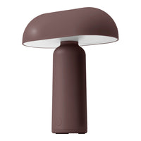 Mushroom-shaped lamp in deep brown with a sleek, matte finish and a white shade. Perfect for modern decor.