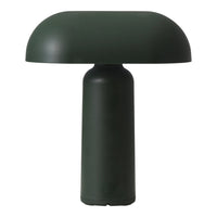Green dome-shaped table lamp with a smooth, modern finish and minimalistic design. Ideal for contemporary decor.