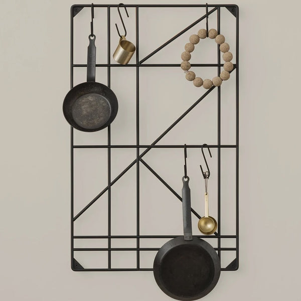 Black geometric wall rack with metal and wooden accents, featuring circular and linear patterns.